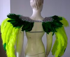 We make and ship our items really fast if you need it for a specific date please let us know. or call/text us at 954-3051817 to complete your order over the phone Ostrich Feather Fairy Wings Epaulet Shoulder Piece Angel Wings Feather Ostrich Fantasy Fest Carnival Showgirl samba Epaulette Shoulder pieces: All the round cut Stones are AB Crystal the Pear shape are Faux Crystal ( available in Silver or Gold) Feather are Ostrich Floss feathers and tips are duck feathers Secured with Glitter matching Feather Fairy, Shoulder Piece, Fantasy Fest, Samba Costume, Feather Angel Wings, Feather Headdress, Gold Feathers, Colorful Feathers, Pow Wow