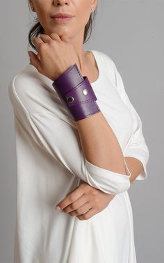 Purple Leather Extravagant Bracelet - METBR7 A wonderful hand accessory in gorgeous purple color! Wear this handmade piece with many colorful outfits and you will definitely be noticed. The cuff is easy to put on and is comfortable on the hand. There are two metal studs on one side of the bracelet and once you close it, the buttons will form another visible two. The bracelet is about 9.5 inches / 24 cm long and closes with two snap buttons. This accessory is made of 100% genuine leather. NOTE! S Purple Wrap, Genuine Leather Bracelet, Hand Accessories, Leather Wristbands, Bracelet Leather, Bracelet Online, Plus Size Maxi, Handmade Jewelry Diy, Purple Leather