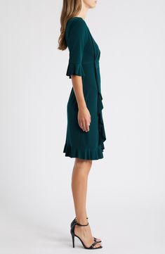 Stretch-enhanced fabric offers desk-to-dinner comfort in a dress framed by ruffled sleeves and finished with front pleats for a gathered affect. 40" length (size 8) Jewel neck Elbow-length sleeves Partially lined 100% polyester Machine wash, tumble dry Imported Elegant V-neck Pleated Dress With Ruffles, Fitted Ruffle Dress With Flutter Sleeves, Elegant Green V-neck Ruffle Dress, Fitted Flutter Sleeve Ruffle Dress, Fitted Flutter Sleeve Dress With Ruffles, Fitted V-neck Pleated Dress With Ruffles, Fitted Ruffle Dress With Flutter Sleeve And Ruffle Hem, Fitted Ruffle Sleeve Dress With Ruched Detail, Fitted Ruched Ruffle Sleeve Dress