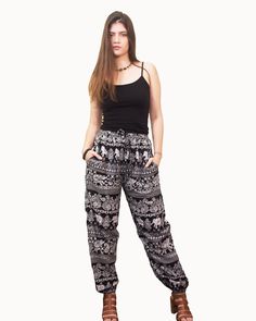 Our Island Vibes pants are glamorous and relaxed and will be your favorite casual lounge wear before you know it! It showcases an adorable white elephant pattern, paired with paisleys and florals for resort wear vibes. Featuring a comfy smocked waistband with a functional drawstring and an elasticized cuff leg, these pants offer a super relaxed fit for day long wear. Handmade Printed using Azo-Free dyes Natural Viscose Cuffed leg fit style Two Side Pockets Smocked stretch waistband with function Casual Boho Print Pants For Vacation, Casual Boho Print Pants, Casual Boho Print Festival Pants, Casual Boho Print Pants For Festivals, Casual Boho Print Harem Pants For Vacation, Bohemian Paisley Print Pants For Vacation, Bohemian Paisley Print Vacation Pants, Casual Cotton Harem Pants With Boho Print, Hippie Harem Pants With Elastic Waistband For Loungewear