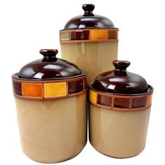 three brown and yellow canisters with lids