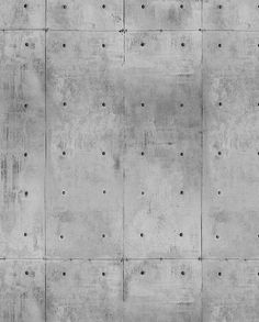 a concrete wall with rivet holes in it