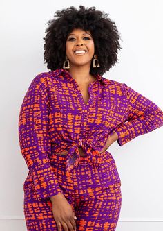 Style# 2106PTA Take a risk and stand out from the crowd in the bold and beautiful Kwamena Women's African Print Button-Up in Purple Tangerine Adire. Perfect for any summer occasion. This lightweight, non-stretch shirt features a stunning African inspired print that show your fashionista side and makes a statement. Whichever your style is, this beautifully designed shirt is sure to make it to your closet. Shop matching items here. Description Long sleeve button-up Long cuff with buttons on sleeve Style Themes, Print Wide Leg Pants, Take A Risk, African Print Clothing, Festival Shop, African Inspired Fashion, Printed Wide Leg Pants, Happy Hair, African Design Dresses