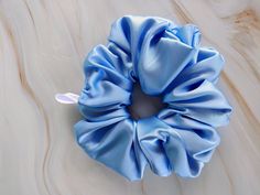 Soft, comfortable and cute hair scrunchie. This hair accessory is a perfect accent to any type of hair. It will save your hair of windy days. This bow is made of silk, elastic and it is handmade. You can tie your hair 3 times with this scrunchie  description: Baby blue silk fabric  elastic thread Size: 5 inches originality:  please note that due to being an original item. and handmade, there might be a slight difference with the item and photos. Process time:  Please allow us 3 to 5 business day Blue Silk Fabric, Blue Scrunchie, Scrunchie Ponytail, Light Blue Hair, Hair Elastic, Scrunchie Hair, Elastic Thread, Ponytail Holder, Women's Hair