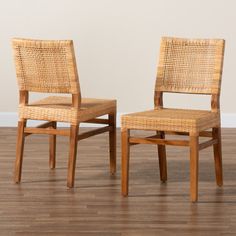 two chairs sitting side by side on top of a hard wood floor