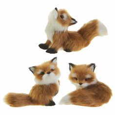 three little fox figurines sitting next to each other