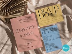 three different types of wedding cards sitting on top of a bed next to each other