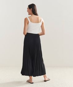 Pleated Skirt Chic Solid Color Pleated Dress, Chic Pleated Dress With Pleated Waist, Solid Chic Pleated Skirt, Chic Pleated Skirt With Folds, Chic Pleated Dress With Solid Color, Chic Stretch Long Pleated Skirt, Chic Long Stretch Pleated Skirt, Chic Flowy Maxi Skirt With Folds, Chic Maxi Skirt With Folds