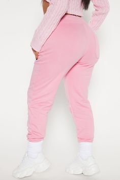 Everyone needs a pair of comfortable joggers in their wardrobe, and our pink Stole Your Boyfriend's Oversized Jogger is the perfect addition. Made with a soft cotton texture, these ankle length joggers feature cuffed hems, a high waisted rise, and straight leg shape. Complete with drawstrings for a customized fit, these joggers are perfect for a sporty look. Whether you're hitting the gym or running errands, these joggers will keep you comfortable and stylish all day. | Stole Your Boyfriend's Ov