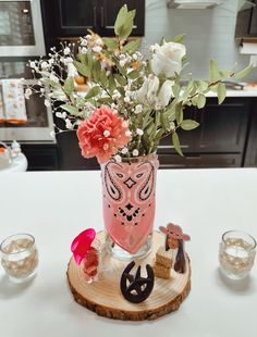 a vase filled with flowers sitting on top of a table