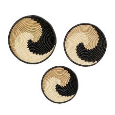 three black and white woven baskets on a white background, each with an individual's own design