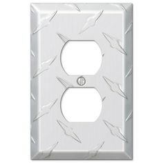 a white outlet cover with an arrow pattern