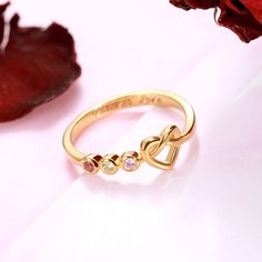 The heart-shaped knot and birthstones beside makes this ring a dainty accessory piece as well as an unfaded love letter. Heart-shaped Birthstone Ring For Mother's Day, Gold Heart-shaped Birthstone Ring, Valentine's Day Gold Birthstone Ring, Ring Gift Box, Birthday Stone, Family Rings, Pg Slot, Ring Crafts, Love Letter