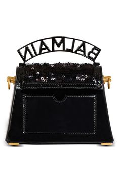 Balmain expands the B-Buzz line with this sequined bag in a structured silhouette traced with tonal disc studs and topped with a banner-style logo handle. A removable crossbody chain strap offers an additional carrying option, while engraved logo hardware puts the label's signature stamp on the look. Magnetic-snap flap closure Top carry handle; removable chain strap Exterior slip pocket Interior wall pocket Structured silhouette with flat base and protective metal feet Lambskin-leather lining Te Designer Evening Bag With Sequins, Designer Evening Bags With Sequins, Luxury Black Sequined Bags, Designer Sequined Evening Bags, Luxury Evening Bags With Sequins, Luxury Sequin Bags For Evening, Luxury Evening Shoulder Bag With Sequins, Luxury Sequined Evening Bags, Luxury Sequined Shoulder Bag For Evening