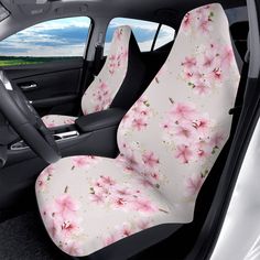 the interior of a car with pink flowers on it