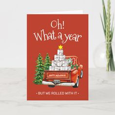 a christmas card with an old red truck and presents on the back that says, oh what a year but we rolled with it