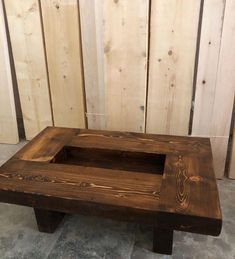 a wooden bench sitting on top of a tile floor