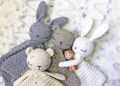 three crocheted stuffed animals laying next to each other