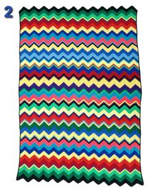 a multicolored blanket with the number two on it's bottom and bottom corner