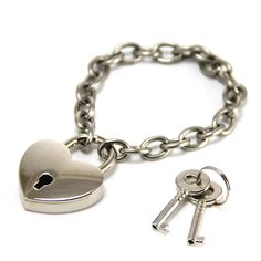 This heart lock and chain bracelet is a real working lock with 2 sets of keys. Wear as a bracelet, or use as a key chain. The lock is the closure for the bracelet. The lock itself measures 1.25" across, 1.5" from top to bottom, and is .25" thick. (4cm high x 3cm wide). The chain is stainless steel and the lock is nickel plated brass. 7" (18 cm) bracelet made of 304 Stainless Steel Chain (2.0x11x8mm) with working plated brass heart lock closure. Fits up to a 7.5" wrist. Lock Bracelet, Black Hills Gold Jewelry, Heart Padlocks, Heart Lock, Grey Style, Black Hills Gold, Jewelry Kits, Beating Heart, 50 Shades Of Grey