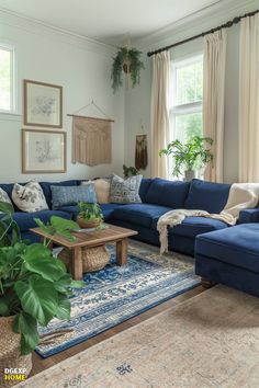 a living room with blue couches and rugs