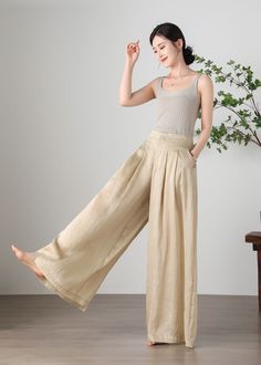 "Cool and comfortable for hot summer days, this apricot wide leg pants is elegant and stylish.    It is a wonderful wardrobe staple that's a timeless classic you'll wear again and again.  All our items are Tailored and Handmade and Made to Order ,I can make Any Size . I design new styles every week, please collect my store. I believe that you will meet your favorite styles. ★★FEATURES Tencel flax Has lining Two side pockets Front zipper closure Wide leg pants Apricot pants Casual pants Long pant Bohemian Summer Pants In Solid Color, Baggy Summer Vacation Bottoms, Bohemian Summer Pants, Baggy Wide Leg Beach Trousers, Baggy Wide Leg Pants For Beach, Summer Wide-leg Relaxed Fit Harem Pants, Summer Casual Wide Leg Harem Pants, Relaxed Fit Summer Harem Pants, Casual Wide Leg Harem Pants For Summer