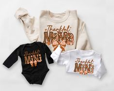 Thankful Mama and Mini Sweatshirt, Mommy and Me Thanksgiving Sweatshirt, Retro Fall, Thanksgiving Shirt, Matching Outfits, Thankful Coquette, 1114 -If you would like any other color of t-shirt, sweatshirt, hoodie, etc., please let me know by sending a message. I will provide it for you. ----------- How to Order Your Custom Design T-shirt ---------- * Choose your t-shirt color * Choose your size * PLEASE make sure all your order's steps Unisex Soft-Style T-shirt The unisex soft-style t-shirt puts Mommy And Me Thanksgiving Outfit, Thankful Mama, Thanksgiving Sweatshirt, Mama And Mini, Thanksgiving Shirt, Thanksgiving Shirts, Fall Thanksgiving, Soft Style, Matching Outfits