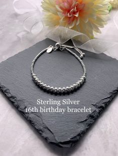 *ITEM DESCRIPTION* This lovely beaded bracelet is made using 2mm sterling silver beads and 16 tube beads which represent 16 years.  This bracelet is also available in 18 and 21 years but can be made with any number of tube beads on request 18th birthday bracelet here https://etsy.me/2t7MoYr  21st birthday bracelet here https://etsy.me/2t8Cequ  There is a choice of silver or rose gold vermeil for the tube beads and can be mixed and matched.  The beads are threaded on to the highest quality beadin Adjustable Sterling Silver Bracelet For Birthday, Silver Hypoallergenic Beaded Bracelets For Birthday, Anniversary Silver Beaded Bracelets, Hypoallergenic Silver Beaded Bracelets For Anniversary, Personalized Silver Beaded Bracelets For Birthday, Personalized Silver Jewelry For Sweet 16, Sterling Silver Bracelet With Spacer Beads For Gift, Silver Sterling Beaded Bracelets For Birthday, Hypoallergenic Beaded Bracelets For Anniversary