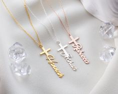 The Personalized Cross Name Necklace is light and comfortable to wear around the neck and suitable for daily use. Handmade from 925 solid sterling silver, high-quality gemstones, and plated with thick 18k gold, that gives our jewelry a perfect sense of elegance. We offer each style in silver, gold, and rose gold. It is a great gift for her for any occasion, such as baptism, Christmas, Valentine's Day, Mother's Day, or other special occasions. Our Personalized Cross Name Necklaces are fantastic a Silver Name Necklace With Cross Shape, Silver Cross Necklaces With Name Detail, Silver Cross Pendant Necklace For Personalized Gift, Silver Name Necklace With Cross Pendant, Silver Cross Pendant Necklace With Name, Silver Cross Jewelry With Name, Silver Necklace For Baptism And Mother's Day, Silver Engraved Necklace For Baptism, Personalized Sterling Silver Necklace For Baptism