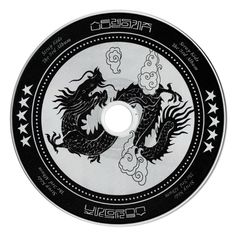 a black and white disc with a dragon on it