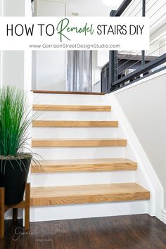 a wooden stair case next to a potted plant