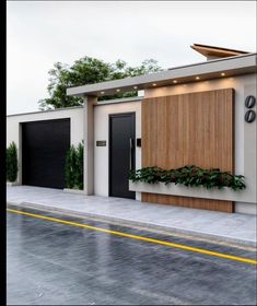 a modern house with two garages and plants on the outside