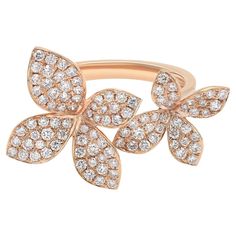 Fun and beautiful diamond double flower cocktail ring. This ring features two beautifully crafted flowers in 18k rose gold, encrusted with dazzling round cut diamonds. A great pick for any occasion. Total diamond weight: 0.95 carat. Diamond quality: G-H color and VS-SI clarity. Ring size 7. Total weight: 5.13 grams. Comes with a presentable gift box. Crafted Flowers, Bezel Diamond Rings, Flower Diamond Ring, Statement Rings Diamond, Amethyst And Diamond Ring, Unique Diamond Rings, Modern Ring, Rose Gold Metal, Diamond Flower