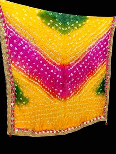 Art Silk Multicolor Tie and Die Bandhani Dupatta|Bandhej Dupatta|Multicolor Dupatta Wrap|Crushed Dupatta|Ethnic dupatta|Designer Scarf Washing Instructions - Do not Machine Wash. Do Not Iron. Good for gifting. Do not worry what to gift. This is better option to gift. Material - Crushed Silk. Dupatta length X Breadth: 2.04 X 0.98 mts. Color: Multicolour Tassels: 2 Comfortable & Durable & Trendy Look. Weight: 135 gm Embroidered designer border with pearl lace and gotta. This dupatta can be paired Yellow Chinon Dupatta With Dori Work, Multicolor Salwar Kameez For Puja And Navratri, Multicolor Dupatta With Cutdana For Puja, Yellow Chinon Dupatta For Navratri, Yellow Chinon Dupatta With Mirror Work, Multicolor Cutdana Salwar Kameez For Puja, Green Bollywood Bandhani Print Dupatta, Multicolor Dupatta For Eid And Puja, Yellow Mirror Work Dupatta For Festivals