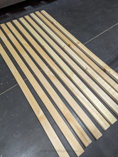 some wood planks are laying on the floor