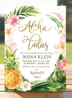 the tropical pineapple and flowers bridal party card is shown on a wooden table