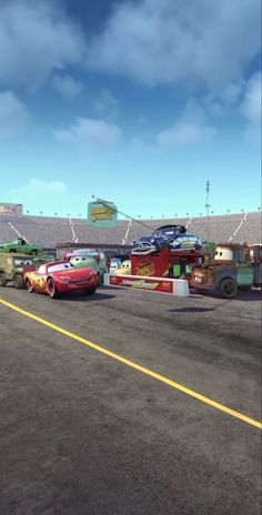 cars are lined up in front of the stadium