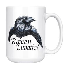 a white coffee mug with a black raven on it's front and the words raven lu