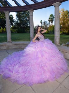 Make a grand entrance in this beaded long sleeveless corset dress with an A-line ruffled tiered skirt from LizLuo Quince by the House of Wu 26095. This quinceañera gown is fit for a princess with its sparkling diamond-like appearance. The corseted bodice features bold and beautiful statement beads, while the exposed boning detail adds a modern touch. The grand and spectacular multi-tiered ruffle skirt is available in two color options: Aqua Multi and Pink Multi. House of Wu LizLuo Quince Collect 1500 Dresses, Embellished Corset, Regal Elegance, Military Ball Dresses, Champagne Dress, Tiered Ruffle Skirt, Corset Bodice, Sparkling Diamond, Ivory Dresses