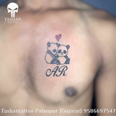 a man with a panda bear tattoo on his chest and the word love is written in cursive writing