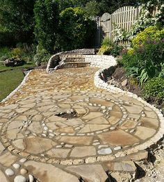 a stone path with stepping stones in the middle