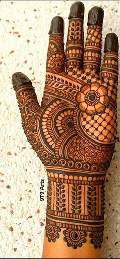 the hand is decorated with intricate designs