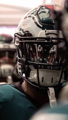 a close up of a football helmet on the back of a player's head