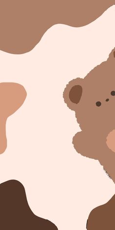 a brown and white teddy bear sitting on top of a cow skin textured background