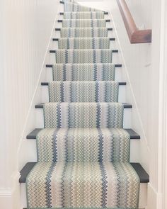 a carpeted staircase leading up to the second floor