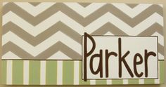 a painting with the word parker on it in brown, green and white chevrons