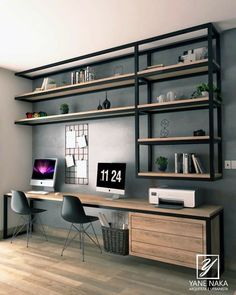 a computer desk sitting in front of a bookshelf filled with lots of shelves