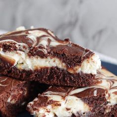 some brownies with white chocolate and marshmallows are stacked on top of each other