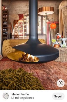 a living room filled with furniture and a fire place next to a rug on the floor