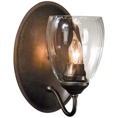 a wall light with a glass shade on it's side and a metal arm